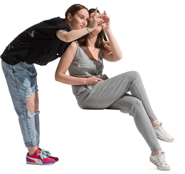 Girl embraces a sitting friend image