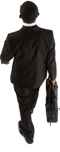 Walking businessman with briefcase image