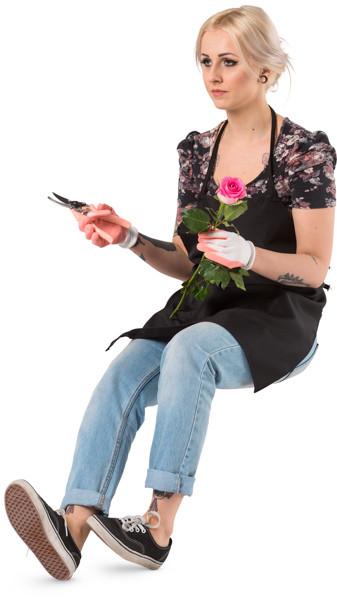 Sitting florist with pruning shears image
