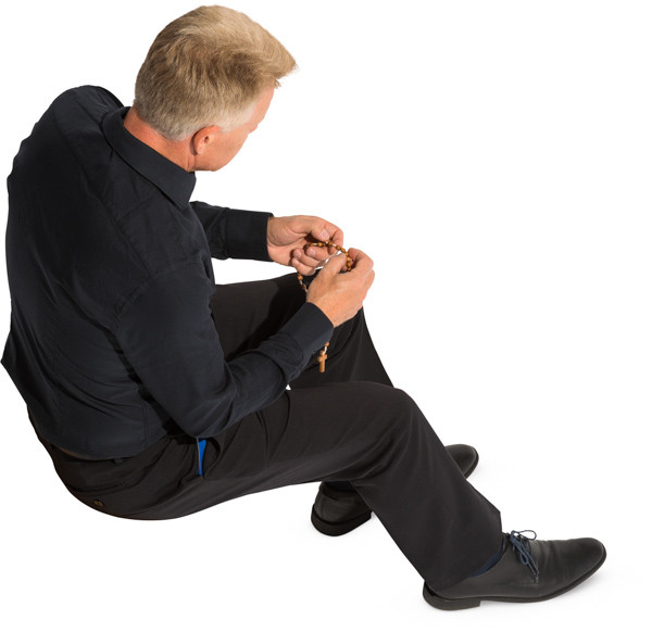 Sitting priest image