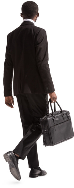 Walking businessman with briefcase image