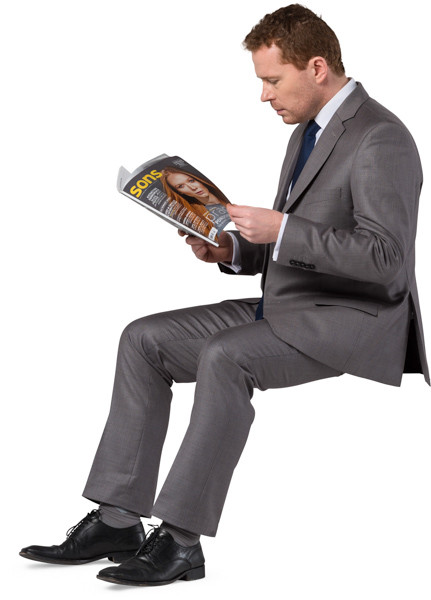 Sitting man with a newspaper image