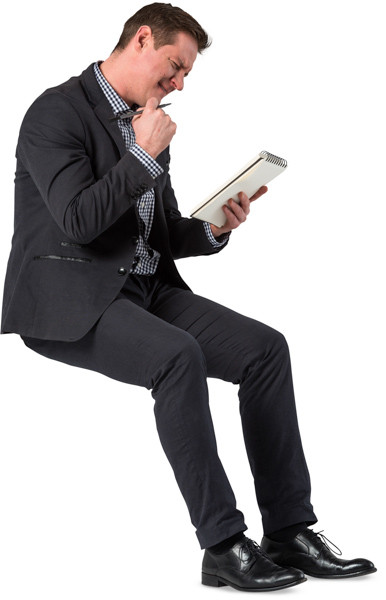 Sitting man with notepad image