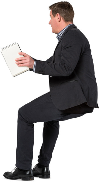Sitting man with notepad image