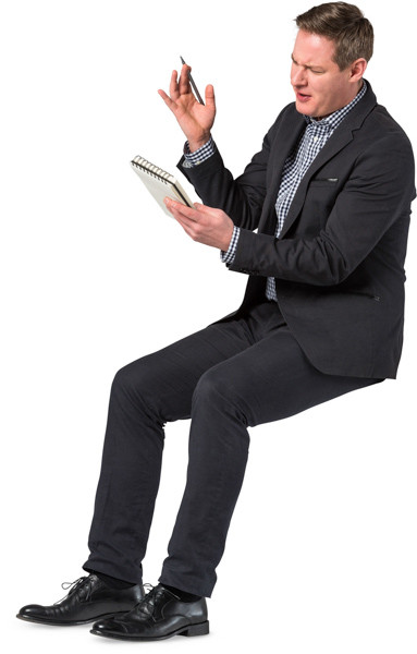 Sitting man with notepad image