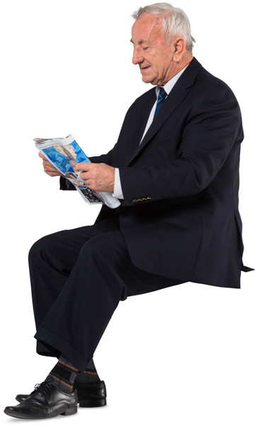 Sitting man with a newspaper image