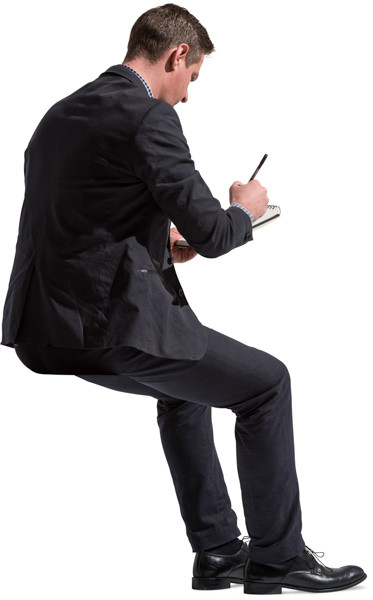 Sitting man with notepad image