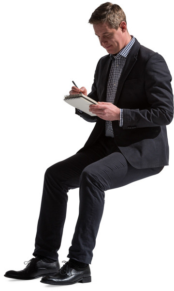 Sitting man with notepad image