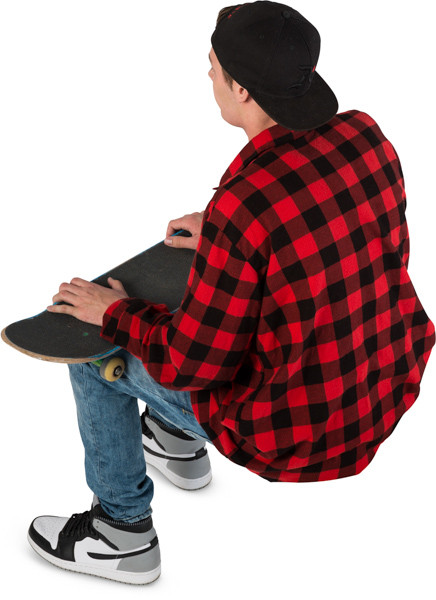 Sitting boy with skateboard image