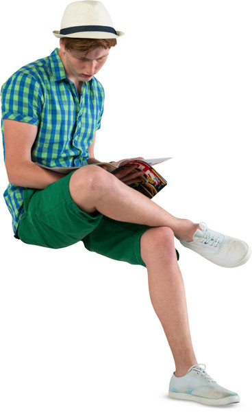 Sitting boy with a magazine image