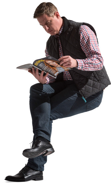 Sitting man with a magazine image