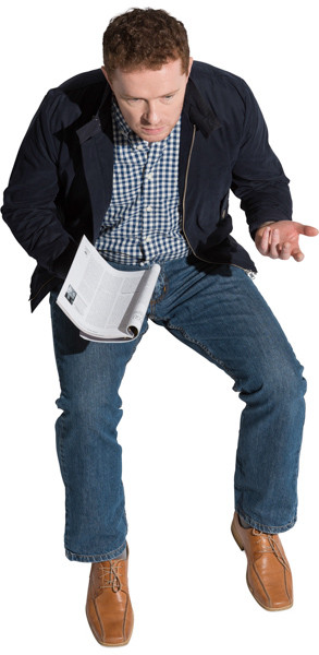 Sitting man with a magazine image