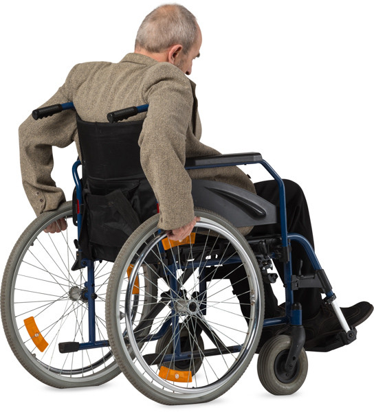 Man riding a wheelchair. 