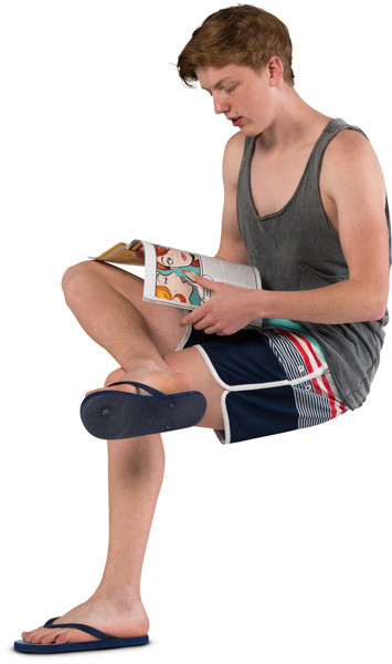 Sitting boy with a magazine image