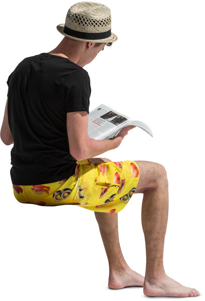 Sitting boy with a magazine image