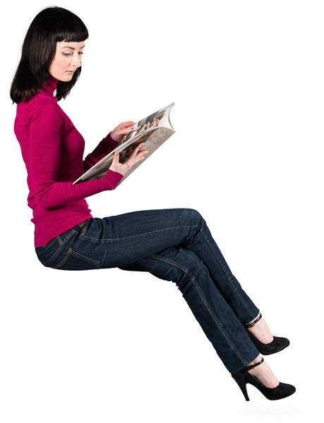 Sitting woman with magazine image