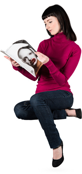 Sitting woman with magazine image