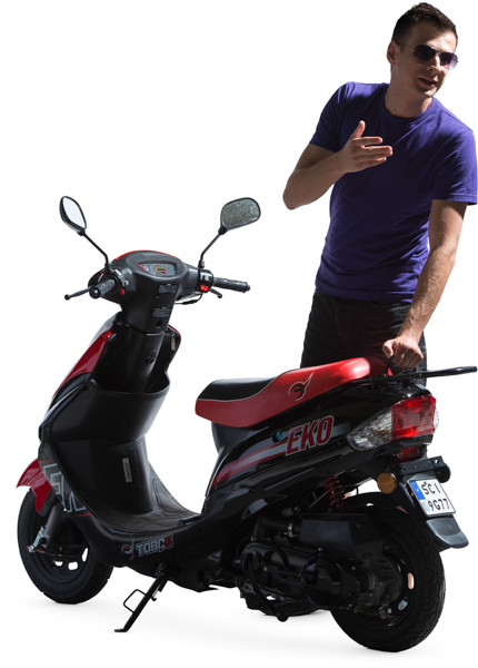 Man standing next to scooter image
