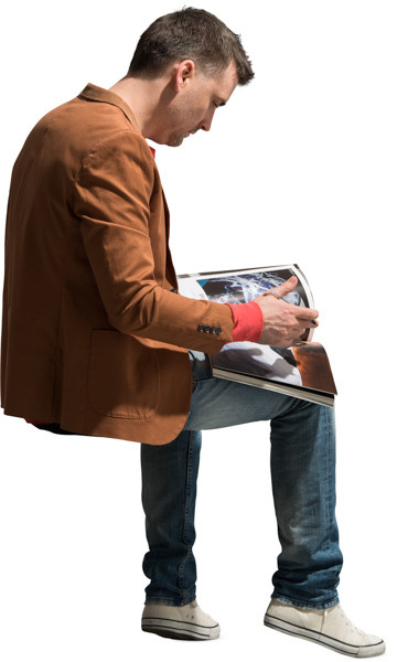 Sitting man with magazine image