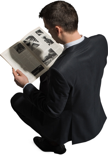 Sitting man with a magazine image