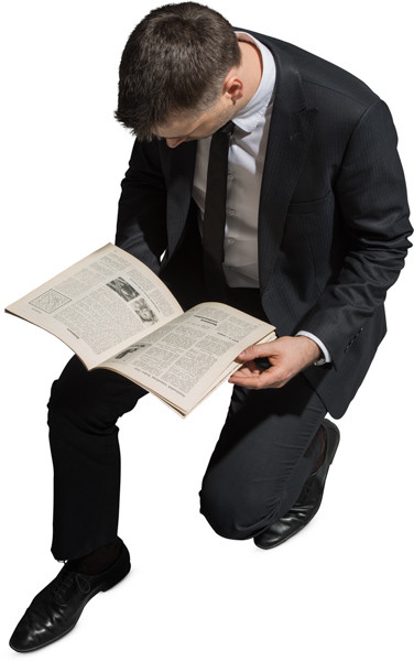 Sitting man with a magazine image