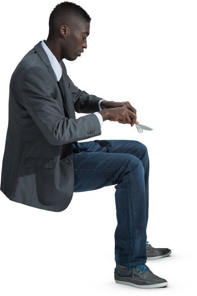 Sitting man eating meal image
