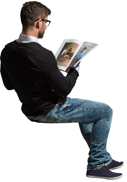 Sitting man with a magazine image