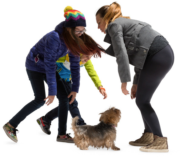 Mother and daughter playing with pet image