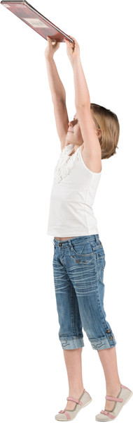 Girl putting a book on shelf image
