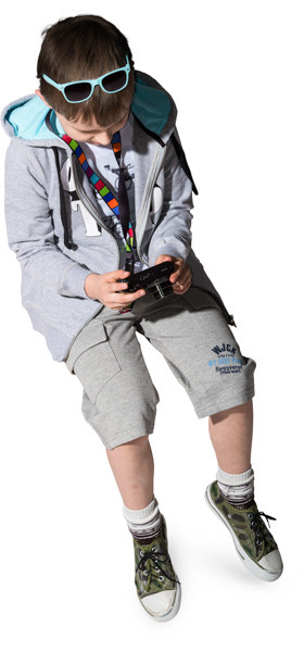 Sitting boy with camera image