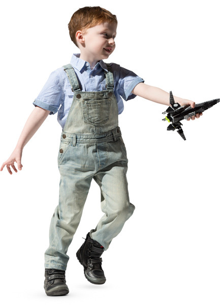 Boy playing with bricks spaceship image