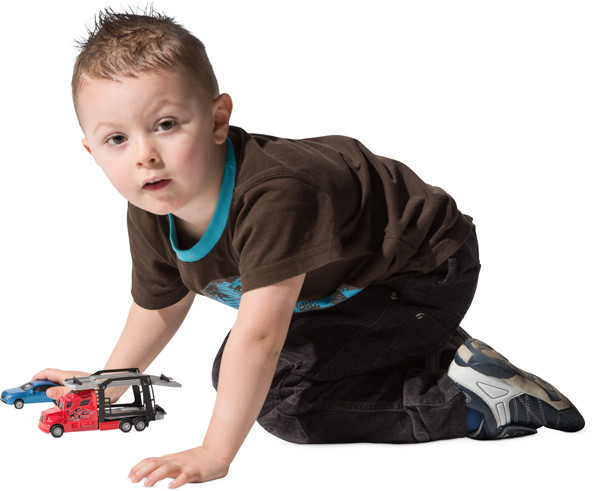 Boy playing with toy car image
