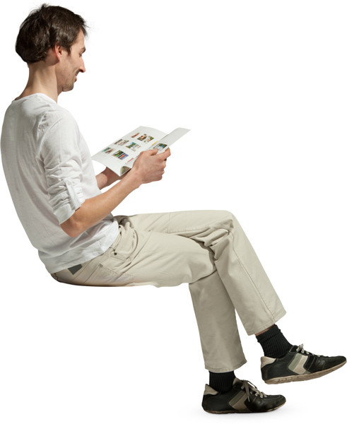 Sitting Man With Magazine