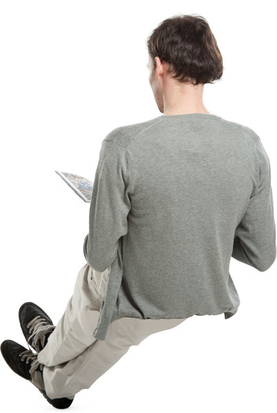 Sitting man with magazine image