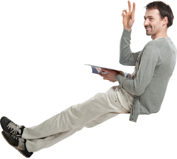 Sitting man with magazine image