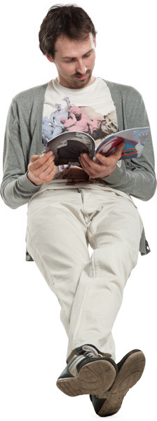 Sitting man with magazine image