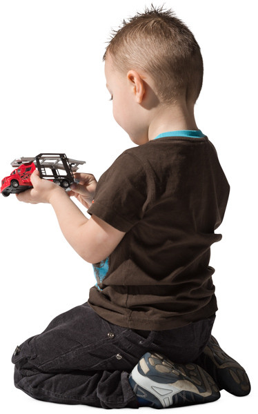 Boy playing with toy car image
