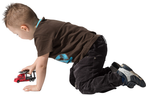 Boy playing with toy car image