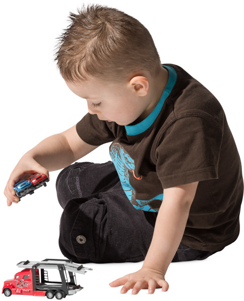 Boy playing with toy car image