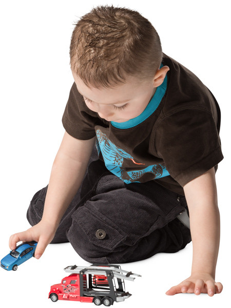 Boy playing with toy car image