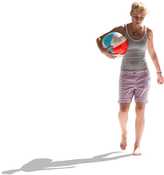 Girl walking with beach ball image