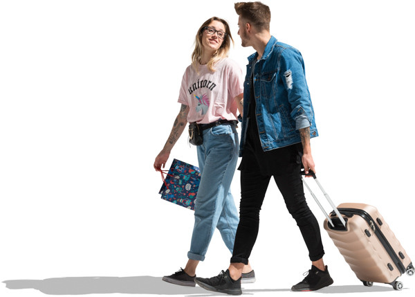 Couple walking in the sun with suitcase image