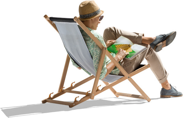 Man on sunbed reading newspaper image