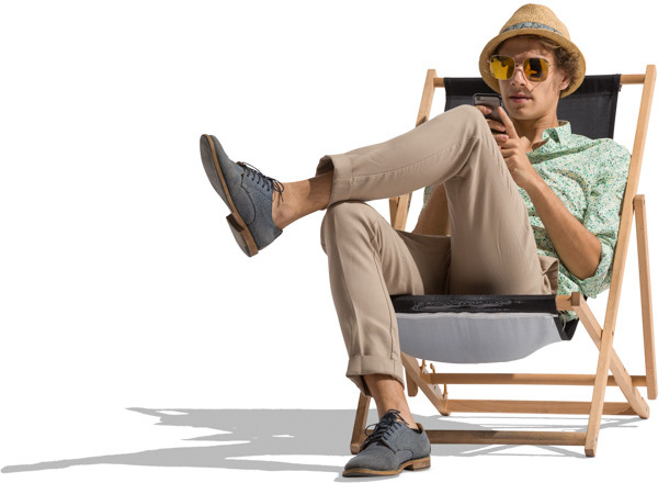 Man with sunglasses sitting on the sunbed image