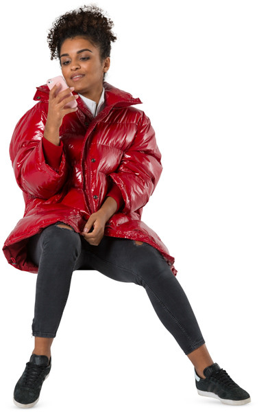 Sitting girl with phone in autumn jacket image