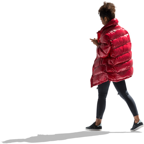 Walking girl in autumn jacket with phone image