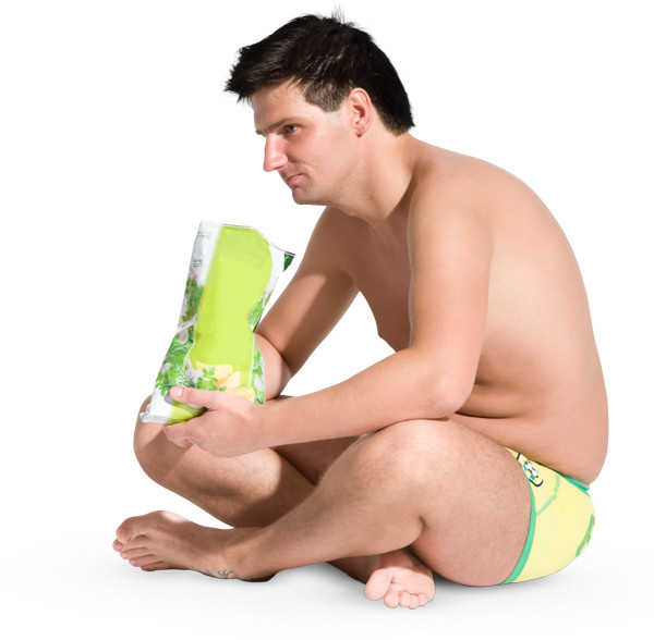 Sitting man eating chips image