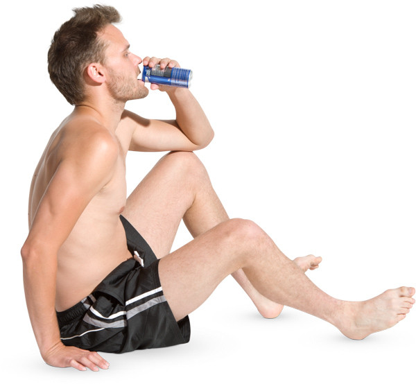 Sitting on the ground man and drinking image