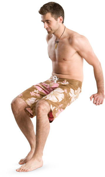 Man sitting in brown shorts image