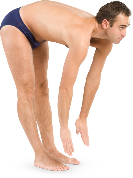 Man bends to his feet image